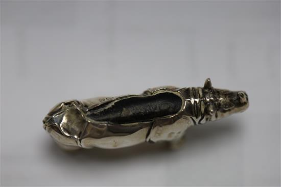 An Edwardian novelty silver pin cushion, modelled as a rhinoceros, Levi & Salaman, Birmingham, 1908, 46mm & two others.